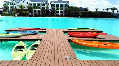 a group of kayaks on a dock in a pool at Playa Azul in Pretoria