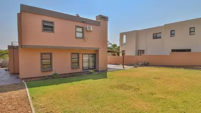 a house with a lawn in front of it at Away like Home in Midrand
