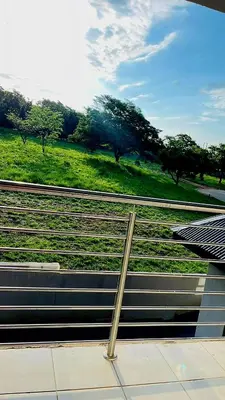 a train station with a view of a green field at The Perazim Place at 222 Sabie River Eco-Estate in Hazyview
