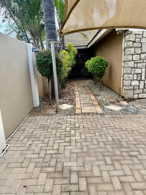 a brick walkway in front of a house at Marie Guest House in Polokwane