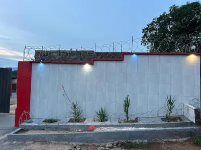a white wall with lights on top of it at Lake boutique hotel empire in Thohoyandou