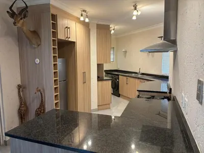 a kitchen with a counter top in a room at Glen Gory stay in Benoni
