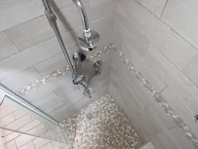 a shower with a shower head in a bathroom at Joy Haven - Cottage in Centurion