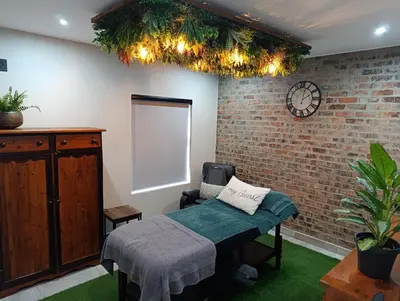 a room with a bed and a brick wall at Joy Haven - Cottage in Centurion