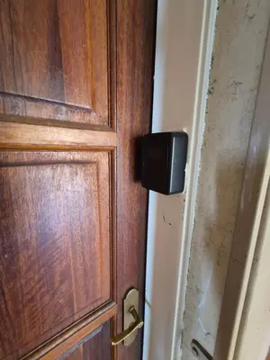a wooden door with a black box on it at Mlangeni's Rest in Centurion