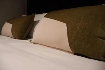 a bed with two pillows on top of it at Urban Oasis Retreat in Midrand in Midrand