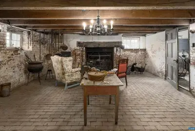 a living room with a table and a fireplace at Vhonani 9 in Polokwane