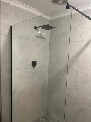 a shower with a glass door in a bathroom at Tucked away with a pool view in White River