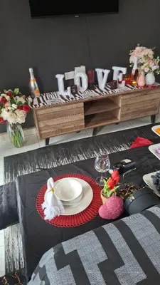 a table with a plate of food on top of it at The Private Location in Thohoyandou