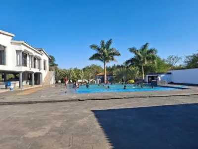 a group of people in a large swimming pool at The Private Location in Thohoyandou