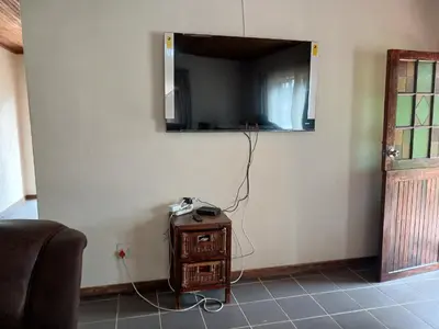 a mirror on a wall in a room with a table at 41 on Clarendon in Graskop