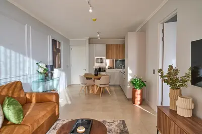 a living room with a couch and a table at Hidden Diamond at Ellipse Waterfall in Midrand