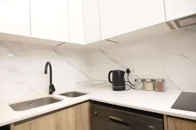 a kitchen with a sink and a counter top at Waterfall Munyaka Estate in Midrand
