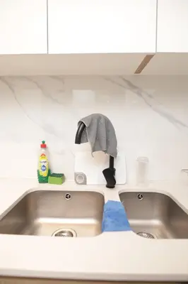 a kitchen counter with a sink with a towel at Waterfall Munyaka Estate in Midrand