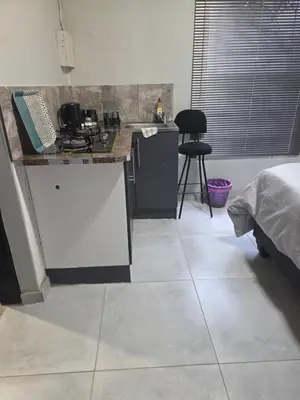 a kitchen with a counter and a counter top at The Good Samaritan 1 in Witbank