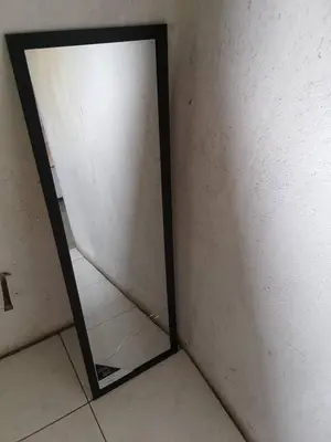 a mirror in the corner of a room at B vhonani in Polokwane
