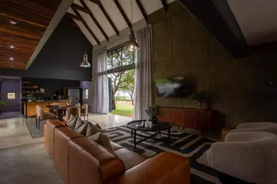 a living room with a couch and a tv at House Nyala in Lydenburg