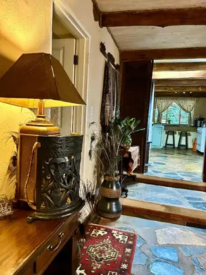 a lamp sitting on a dresser in a room at Gunyatoo Trout Trout Farm & Guest Lodge in Sabie