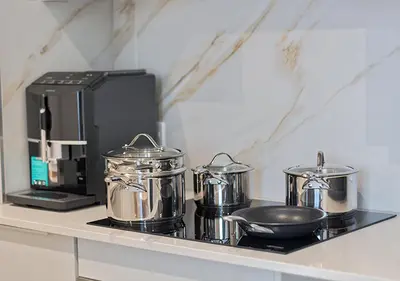 a counter with pots and pans on top of a stove at MNM Luxury Suit 424 in Pretoria