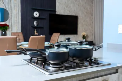 three pots on top of a stove in a kitchen at Modern 3-Bedroom Retreat Fully Equipped Comfort in Midrand