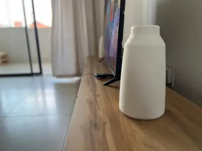 a white bottle sitting on top of a wooden table at Spacious 2 bedroom, 2 bathroom unit in Pretoria