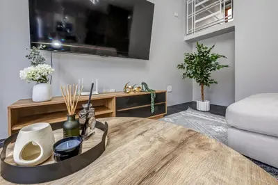 a living room with a table and a couch at Carlswald Escape in Midrand