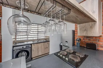 a kitchen with a stove and a sink at Carlswald Escape in Midrand