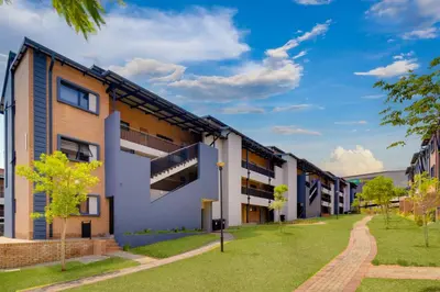 an image of an apartment building with a lawn at Home Affairs by Waterfall in Midrand