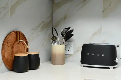 a kitchen counter with a toaster and other kitchen utensils at 438 The Capital Trilogy in Pretoria