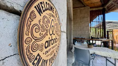 a wooden sign on the wall of a restaurant at Figtree Escape in Marloth Park