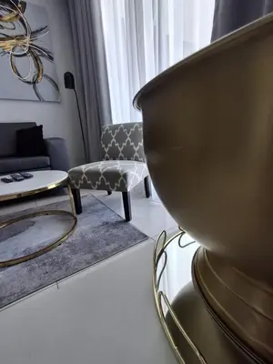a living room with a couch and a table at Ellipse 1-Bedroom Lux Apartment in Midrand
