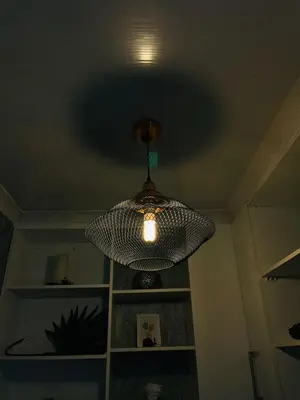 aendant light hanging from a ceiling in a room at Legae la rena in Polokwane