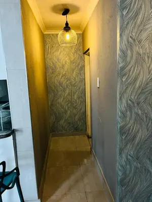 a hallway with a wall with a painting on it at Legae la rena in Polokwane