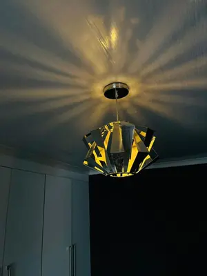 a chandelier hanging from a ceiling in a room at Legae la rena in Polokwane