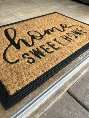 a welcome mat with the words my smile is new at Kiewiets Nest Guesthouse in Pretoria