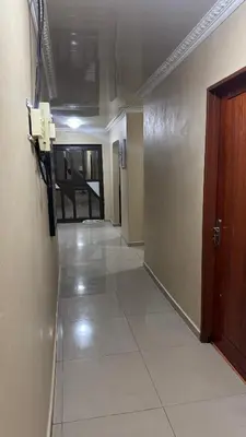an empty hallway with a phone in a hotel room at Makhuvha Tshilivho Luxury House in Thohoyandou