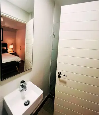 a bathroom with a sink and a mirror at Regency Menlyn, 2 Bed Spacious Double Storey, New! in Pretoria