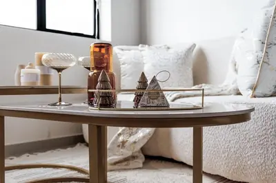 a coffee table with two glass ships on it at The Nest in Midrand