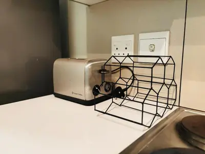 a toaster sitting on top of a kitchen counter at Cozy getaway in Midrand