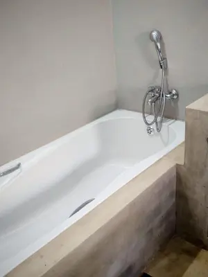 a white bath tub with a faucet in a bathroom at Neotha Villa Unit 1 in Marloth Park