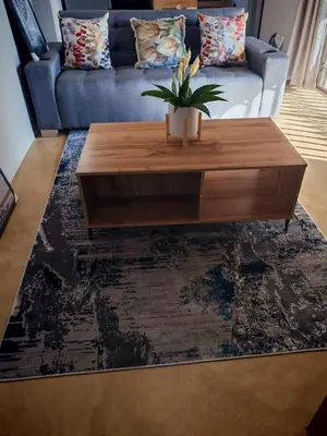 a living room with a coffee table and a couch at Neotha Villa Unit 1 in Marloth Park