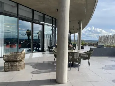 a patio with a table and chairs on a building at Entire Apartment in Midrand, South Africa in Midrand