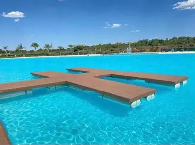 a swimming pool in the middle of the blue water at 2 Bed Lux apartment at The Blyde in Pretoria