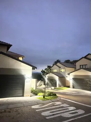 a row of houses with garage doors on a street at Elusive Haven in Nelspruit