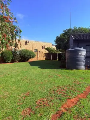 a yard with a building and a water tank at 43 Home Reyno ridge in Witbank