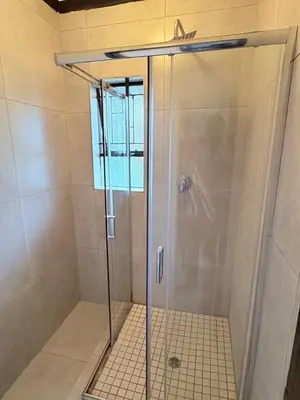 a shower with a glass door in a bathroom at 43 Home Reyno ridge in Witbank