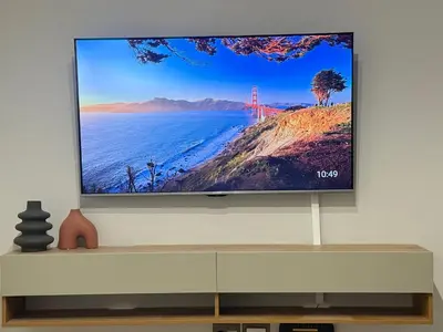 a flat screen tv sitting on a wall at Sunrise Waterfall at ELLIPSE in Midrand