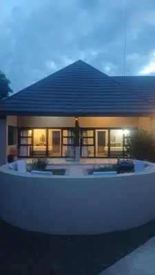 a house with lights on in the night at Fikani game lodge in Thabazimbi