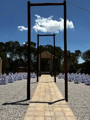 a walkway leading to a set of white chairs at The Vibe Venue in Pretoria