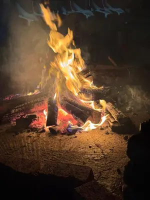 a fire is burning in a brick oven at The Vibe Venue in Pretoria